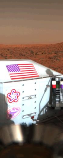 This color image shows the U.S. flag adorning the side of the Viking lander on the surface of Mars.