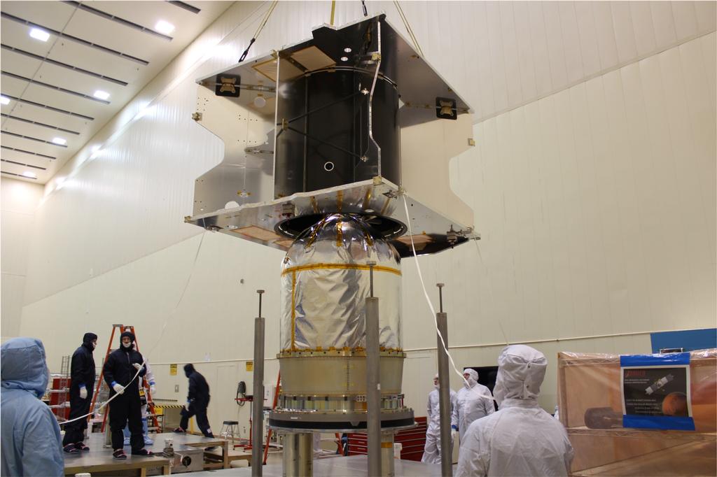 The MAVEN spacecraft core structure is successfully lowered and mated to the hydrazine propulsion tank and boat tail assembly at Lockheed Martin, Denver.