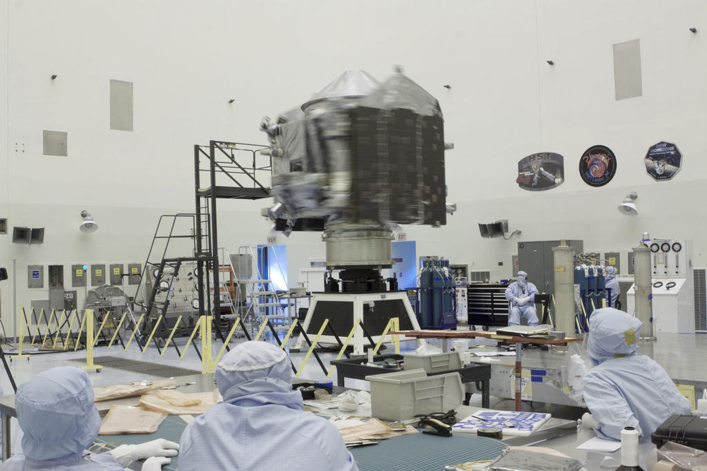 Inside the Payload Hazardous Servicing Facility at NASA's Kennedy Space Center in Florida, engineers and technicians perform a spin test of the Mars Atmosphere and Volatile Evolution, or MAVEN, spacecraft.