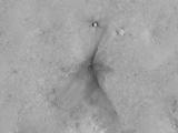 This image from the NASA Mars Reconnaissance Orbiter shows an impact scar on Mars made by pieces of the NASA Mars Science Laboratory spacecraft that the spacecraft shed just before entering the Martian atmosphere.