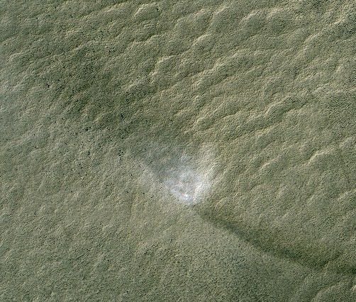 This telescopic view from orbit around Mars catches a Martian dust devil in action in the planet's southern hemisphere.