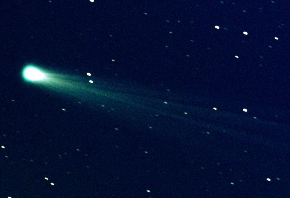 Comet ISON streaks through a star-filled sky on its way around the Sun.