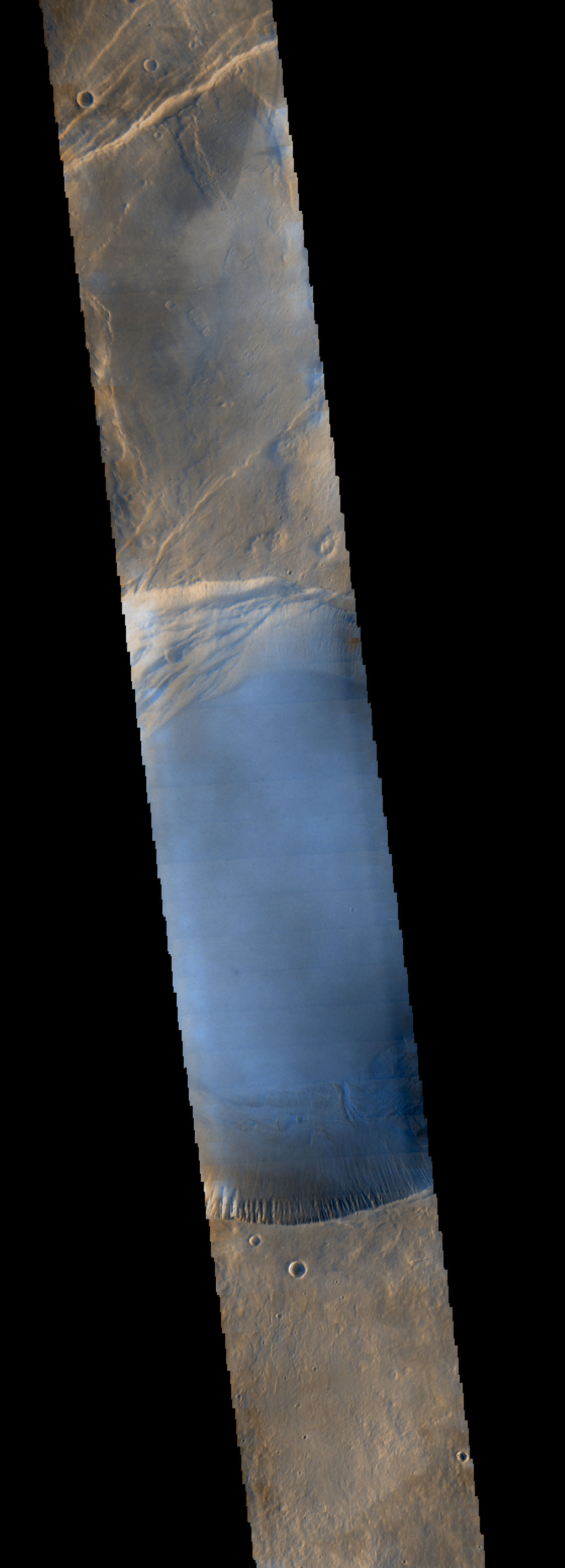 Seen shortly after local Martian sunrise, clouds gather in the summit pit, or caldera, of Arsia Mons, a giant volcano on Mars, in this image from the Thermal Emission Imaging System (THEMIS) on NASA's Mars Odyssey orbiter.