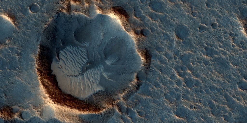 This May 2015 image from the HiRISE camera on NASA's Mars Reconnaissance Orbiter shows a location on Mars associated with the best-selling novel and Hollywood movie, "The Martian." It is in a region called Acidalia Planitia, at the landing site for the science-fiction tale's Ares 3 mission.
