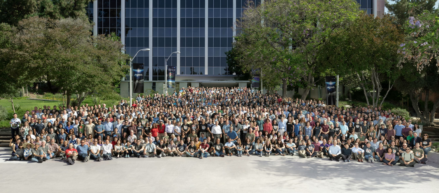 The members of the Mars 2020 mission gathered in front of a building at NASA's Jet Propulsion Laboratory