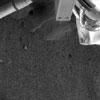 Read the article 'NASA'S Phoenix Lander Robotic Arm Camera Sees Possible Ice'